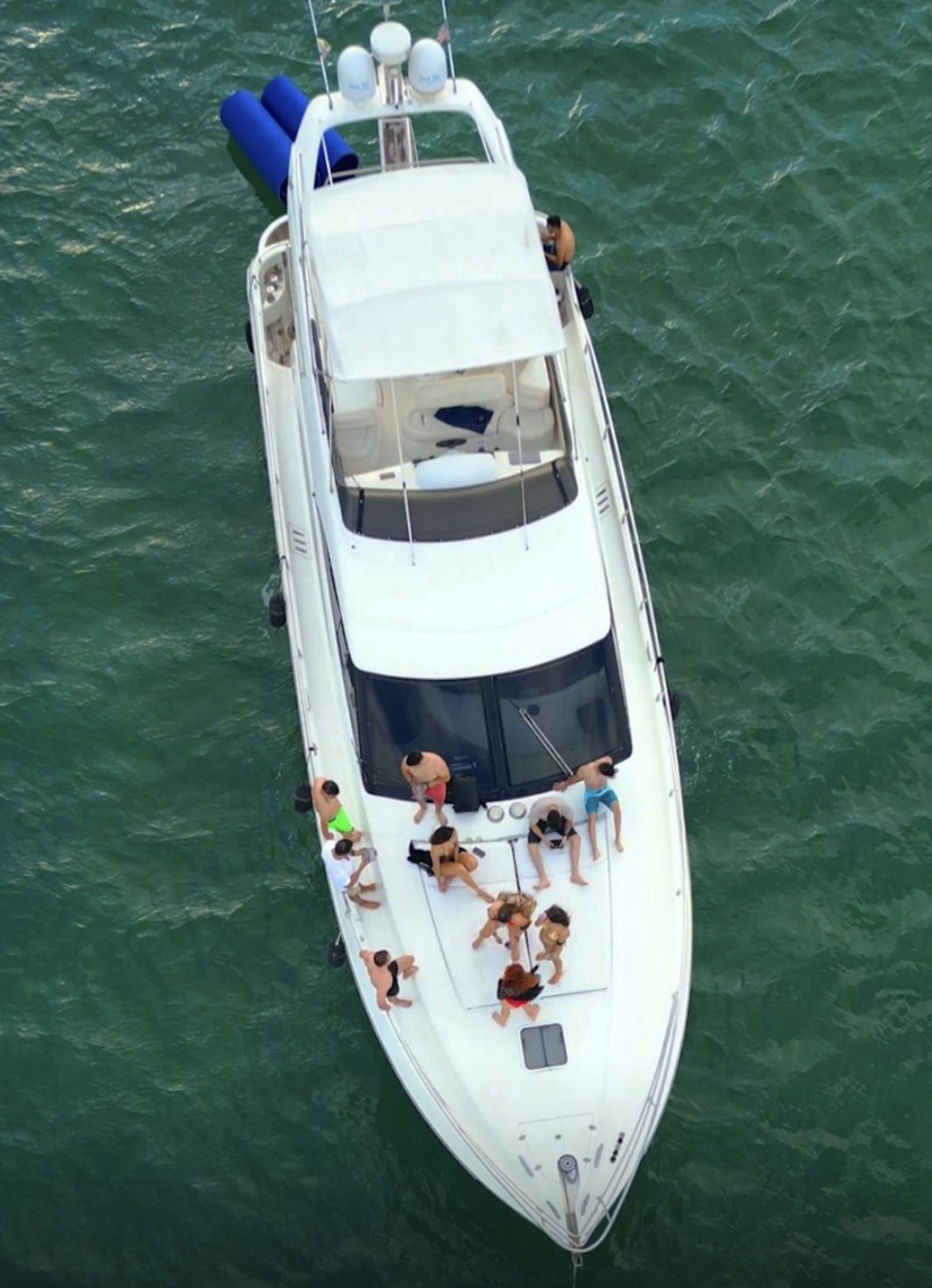 Guests relaxing on the bow of Samba Soul, seen from above